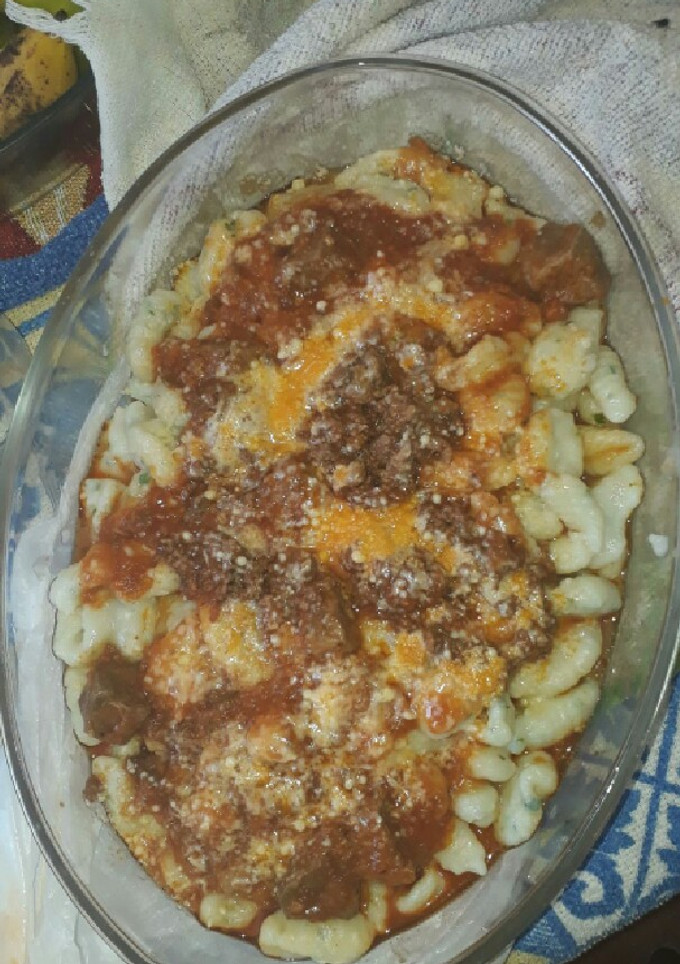 Una foto de Ñoquis de papa con salsa