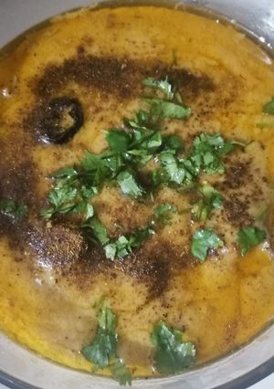 A picture of Curry pakora in green and with red Chilli tarka.