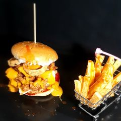 A picture of Zinger Burger with Fries.