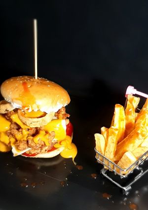 A picture of Zinger Burger with Fries.