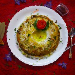 A picture of Vegetable pulav with badam theri.