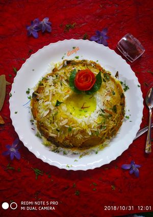 A picture of Vegetable pulav with badam theri.