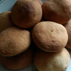 A picture of Soft fluffy Baked cardamon mandazi.