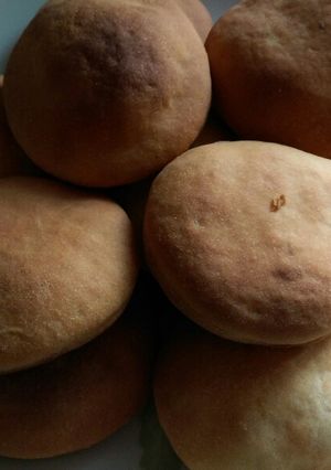 A picture of Soft fluffy Baked cardamon mandazi.
