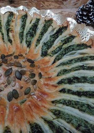 Una foto de Girasol de hojaldre con ricotta y espinacas