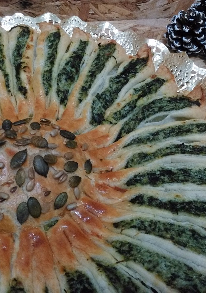 Una foto de Girasol de hojaldre con ricotta y espinacas