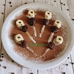 A picture of Dark chocolate and banana pops.