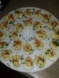 A picture of truffle deviled eggs with lox.