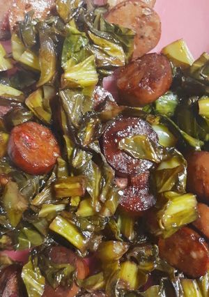 A picture of Sauteed collard greens with sausage.