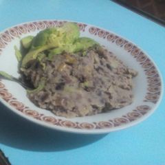 A picture of Mukimo served with avocado.