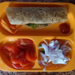 A picture of Egg wrap with veggies.