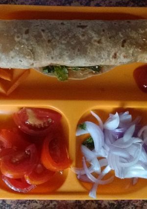 A picture of Egg wrap with veggies.