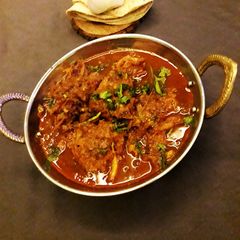 A picture of Pyaaj pakuda curry with chapati for lunch.