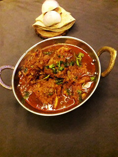 A picture of Pyaaj pakuda curry with chapati for lunch.