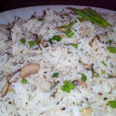 A picture of Mushroom Rice with sesame seeds and oregano.