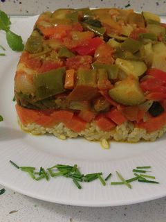 Una foto de Ratatouille con risotto de finas hierbas