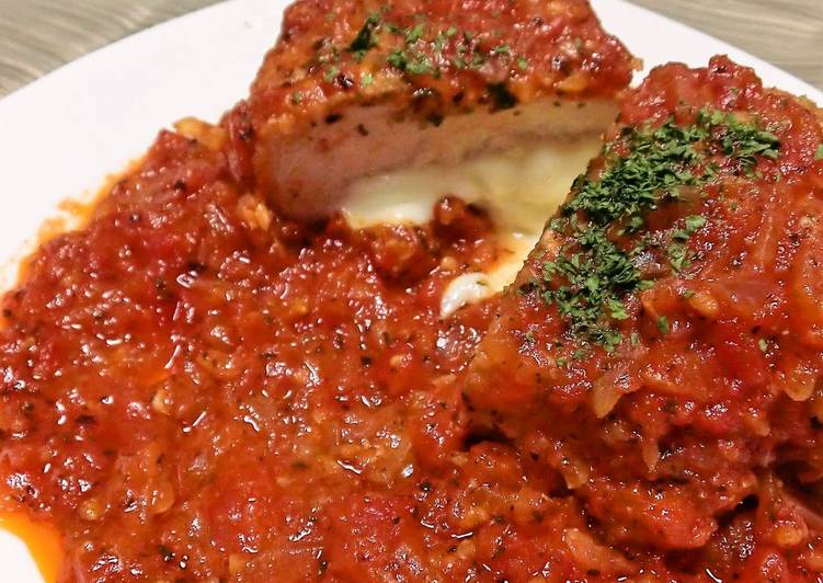 Herb Breaded Chicken Breast Served in Tomato Sauce