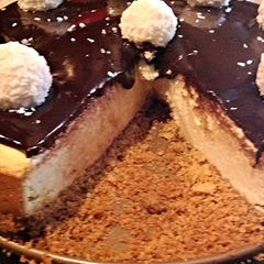 A picture of Coconut Cheesecake With Chocolate Ganache.