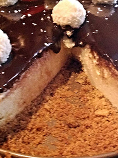 A picture of Coconut Cheesecake With Chocolate Ganache.