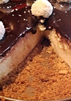 A picture of Coconut Cheesecake With Chocolate Ganache.