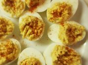 A picture of deviled eggs with avocado