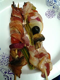 A picture of Bacon wrapped kebabs.