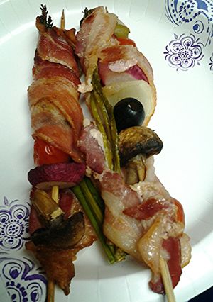 A picture of Bacon wrapped kebabs.