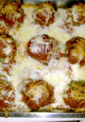 A picture of Vermont Cheddar Stuffed Meatballs with baked spaghetti..