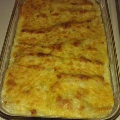 A picture of Cheesy green chile chicken enchiladas.