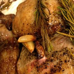 A picture of Rack of lamb with fresh rosemary.