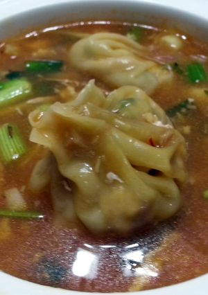 A picture of Dumpling In Thai Chili Broth.