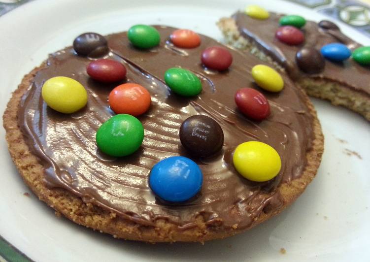 Biscuits with nutella and m&m's topping