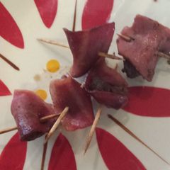 A picture of (Turkey) Bacon wrapped (Elk) steak.