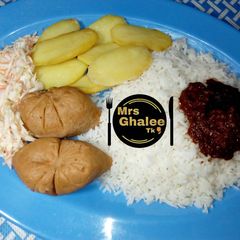 White rice with stew moimoi and coleslow A picture of White rice with stew moimoi and coleslow.
