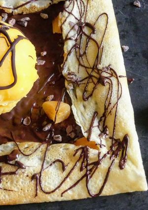 A picture of Chocolate Dessert Crêpes with Homemade Mango Sorbet.