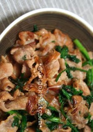 A picture of Crispy Pork and Chrysanthemum Greens Stir-Fry with Bonito Flakes.