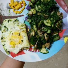 A picture of Spinach zucchini and mushrooms stir fry.