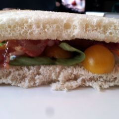 Bacon and Basil Sandwich with Goat Cheese Brie and Golden Tomatoes A picture of Bacon and Basil Sandwich with Goat Cheese Brie and Golden Tomatoes.
