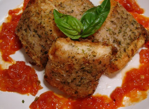 A picture of Pan Fried Pork-Wrapped Hanpen Fish Cakes with Basil.