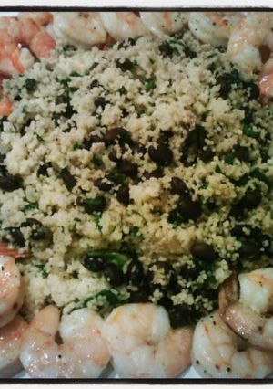 A picture of Black bean & spinach couscous with baked shrimp.