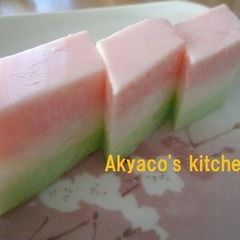 A picture of Tricolored Agar-based Milk Jelly with Shaved Ice Syrup for the Japanese Doll Festival.