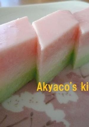 A picture of Tricolored Agar-based Milk Jelly with Shaved Ice Syrup for the Japanese Doll Festival.