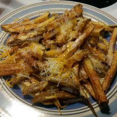 A picture of Home made cheese fries.
