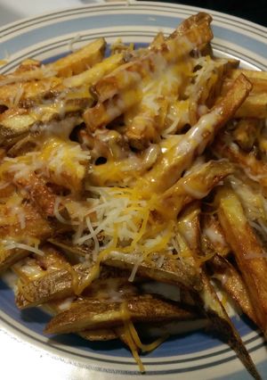 A picture of Home made cheese fries.
