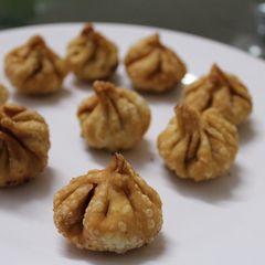 Modak with sesame seeds and jaggery A picture of Modak with sesame seeds and jaggery.