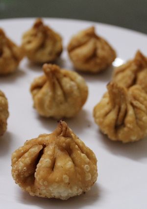 A picture of Modak with sesame seeds and jaggery.