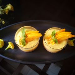 A picture of Mini mango cheese cake shots.