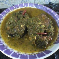 A picture of Coriander  lemon  fish curry.