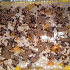 A picture of WARM AND GOOEY PEACH COBBLER.