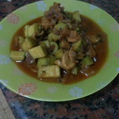 A picture of zucchini and mushroom in sweet red pepper sauce.